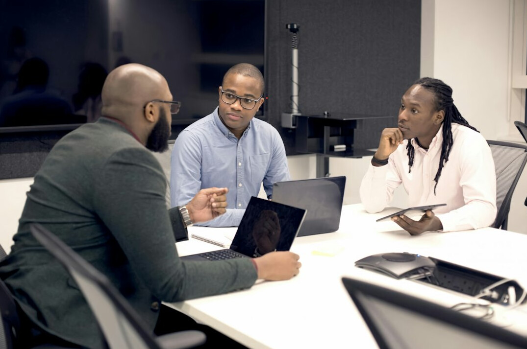 team discussing ai insurance