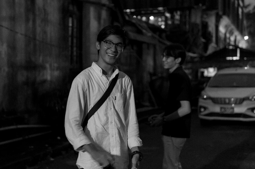 Japanese man in glasses smiling