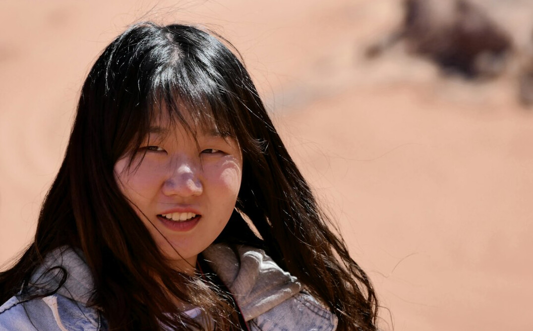 Japanese woman with long hair smiling