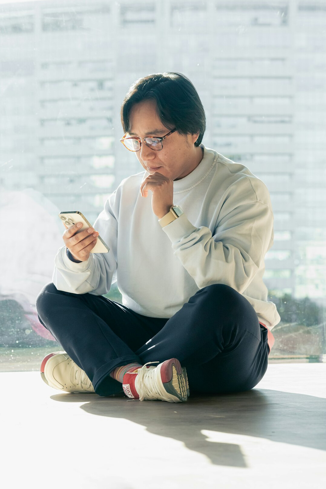 Japanese software engineer working thoughtfully