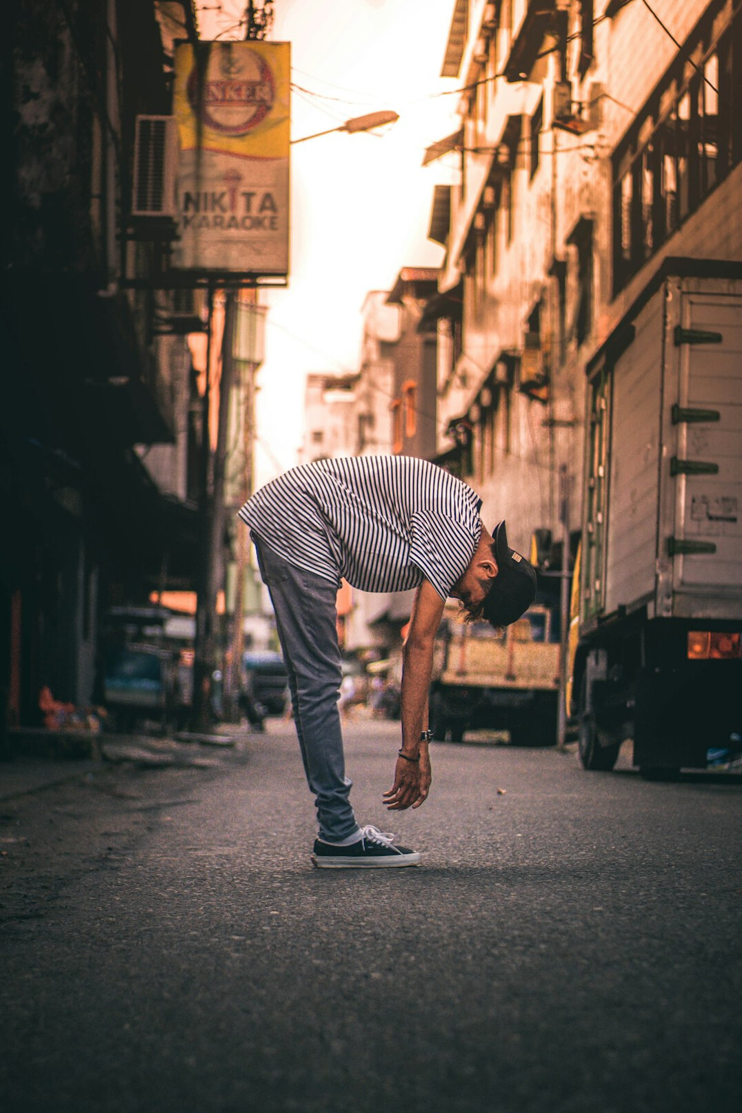 Japanese man stretching after a long work session